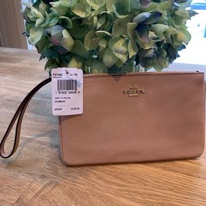 Brand new with tags Blush Coach wristlet